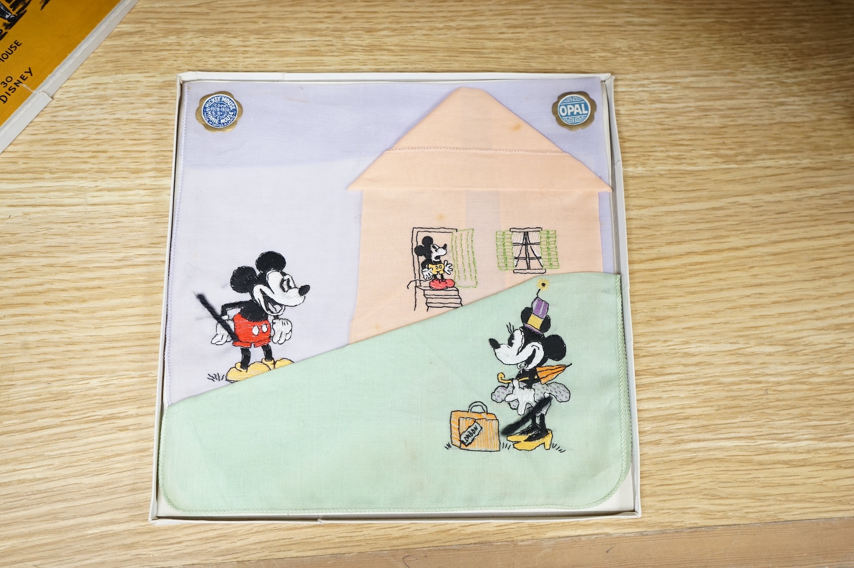An early Walt. E. Disney Mickey Mouse and Minnie Mouse boxed, coloured embroidered handkerchief set. Box 20.5cm x 20.5cm square.
